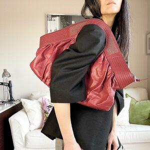 Leather slouchy oversized burnt red shoulder bag with studs
